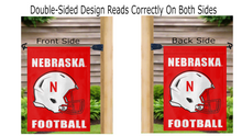 Load image into Gallery viewer, Red University of Nebraska Football Garden Flag hung from mailbox flagpole reading correctly on both sides