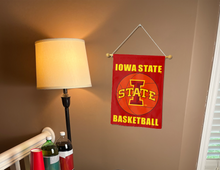 Load image into Gallery viewer, Iowa State basketball garden flag hanging on banner pole next to a lamp and drinks