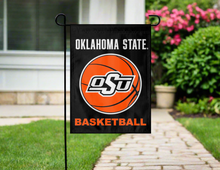 Load image into Gallery viewer, Oklahoma State basketball garden flag in front of a house with a pathway and flowers.
