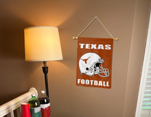 Load image into Gallery viewer, texas longhorns football garden flag hanging on banner pole next to a lamp and two drinks