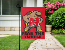 Load image into Gallery viewer, red university of maryland garden flag with fear the turtle logo hung outside from garden flag stand