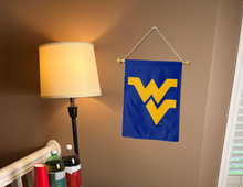 Load image into Gallery viewer, blue west virginia university garden flag hanging on banner pole inside living room
