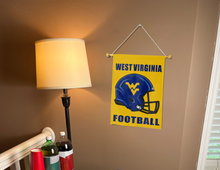 Load image into Gallery viewer, west virginia football garden flag hanging on a banner pole next to a lamp and drinks