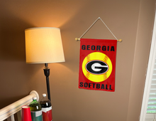 Load image into Gallery viewer, georgia softball garden flag hanging on banner pole next to a lamp and drinks