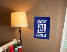 Load image into Gallery viewer, blue rice university garden flag hanging on banner pole inside living room