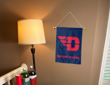 Load image into Gallery viewer, blue University of Dayton Garden Flag hung from banner pole inside living room