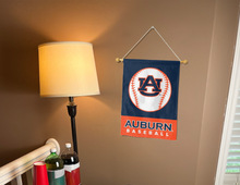 Load image into Gallery viewer, blue and orange Auburn Baseball Garden Flag hanging on banner pole inside living room