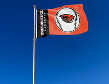 Load image into Gallery viewer, Black and Orange 3x5 Oregon State Baseball Flag with two metal grommets attached to flagpole waving in the wind