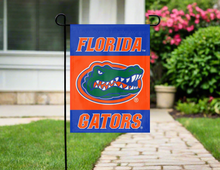 Load image into Gallery viewer, blue and orange university of florida gators garden flag hung outside from garden flag stand