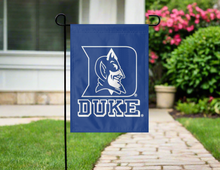 Load image into Gallery viewer, blue duke university garden flag hung outside from garden flag stand