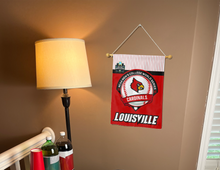 Load image into Gallery viewer, louisville baseball college world series 2025 garden flag hung from banner pole inside living room
