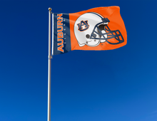 Load image into Gallery viewer, Orange and blue 2 panel 3x5 Auburn University Football Flag with Two metal grommets attached to flagpole waving in the wind