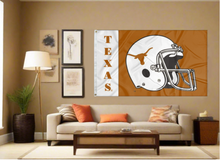 Load image into Gallery viewer, Two panel white and orange University of Texas Football Flag with two metal grommets covering tan wall of well lit room