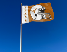 Load image into Gallery viewer, Two panel white and orange University of Texas Football Flag with two metal grommets attached to flagpole waving in the wind