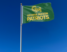 Load image into Gallery viewer, 3x5 George Mason University Flag with two metal grommets for indoor home décor attached to flagpole waving in the wind