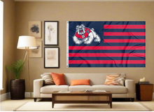 Load image into Gallery viewer, Fresno State University Flag with seven navy stripes and six red stripes and two metal grommets for indoor home décor covering tan wall of well lit room