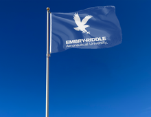 Load image into Gallery viewer, Embry-Riddle Aeronautical University Daytona Beach Flag attached to flagpole waving in the wind