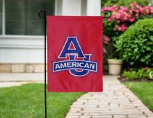 Load image into Gallery viewer, Red 13x18 inch long American University Garden Flag hanging on a black Garden flag stand in front of a yard