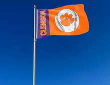 Load image into Gallery viewer, Purple and Orange 3x5 Clemson University Flag with Clemson Baseball Logo and Two Metal Grommets attached to flagpole waving in the wind