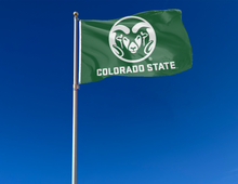Load image into Gallery viewer, Green 3x5 foot wide Colorado State University Flag with ram head logo and two metal grommets attached to flagpole waving in the wind
