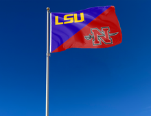Load image into Gallery viewer, purple and red LSU Nicholls State House divided flag attached to flagpole waving in the wind
