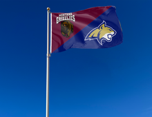 Load image into Gallery viewer, maroon and blue house divided Montana Montana State Game Flag attached to flagpole waving in the wind
