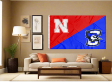 Load image into Gallery viewer, red and blue Nebraska Creighton House divided flag covering living room wall