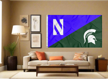 Load image into Gallery viewer, purple and green Northwestern Michigan State House Divided flag with two metal grommets covering tan wall of living room