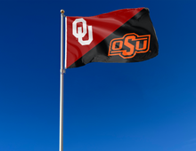 Load image into Gallery viewer, red and black Oklahoma Oklahoma State House Divided Flag attached to flagpole waving in the wind