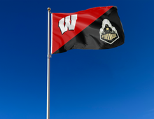 Load image into Gallery viewer, red and black Wisconsin Purdue house divided flag with two metal grommets attached to flagpole waving in the wind