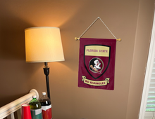 Load image into Gallery viewer, indoor display of FSU garden flag with shield and go Seminoles logos as part of man cave decor