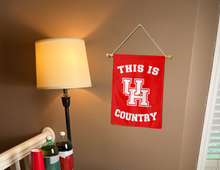 Load image into Gallery viewer, this is houston cougars country garden flag hung inside college dorm