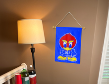 Load image into Gallery viewer, University of Kansas Garden flag with Baby Jay logo hung inside as part of college dorm decor