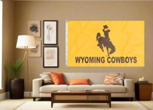Load image into Gallery viewer, Gold Wyoming cowboys 3x5 flag displayed inside a college dorm for man cave decor