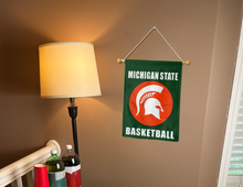 Load image into Gallery viewer, Michigan State basketball garden flag hung inside a college dorm for decor