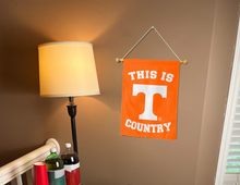 Load image into Gallery viewer, this is Tennessee country garden flag hung inside as part of man cave decor