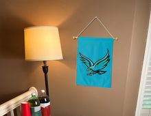 Load image into Gallery viewer, uhcl garden flag hung on a banner pole inside of a college dorm