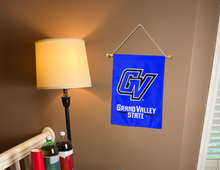 Load image into Gallery viewer, grand valley state university garden flag hung inside for college dorm decor