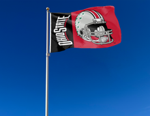 Load image into Gallery viewer, Red and Black Ohio State Football 3x5 Flag with two metal grommets attached to flagpole waving in the wind