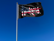 Load image into Gallery viewer, University of Nebraska flag with USA flag striped Huskers logo attached to flagpole waving in the wind