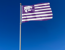 Load image into Gallery viewer, USA Flag Style Kansas State University 3x5 Flag with seven purple stripes six white stripes and two metal grommets attached to flagpole waving in the wind