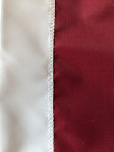 Load image into Gallery viewer, Hand sewn part of O logo for University of Oklahoma Applique Flag with two metal grommets for indoor home décor