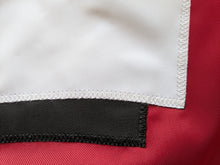 Load image into Gallery viewer, Bottom part of Hand-sewn logo of Red University of Wisconsin Applique Flag with two metal grommets