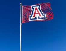 Load image into Gallery viewer, Samoan style 3x5 foot wide University of Arizona flag with two metal grommets attached to flagpole waving in the wind