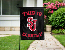 Load image into Gallery viewer, black double sided garden flag with this is st john's red storm country logo for yard decor