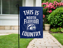 Load image into Gallery viewer, blue double sided garden flag with this is north florida ospreys country logo for yard decor