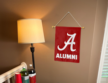 Load image into Gallery viewer, alabama alumni garden flag hung inside a college dorm for dorm decor