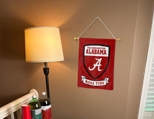 Load image into Gallery viewer, university of alabama garden flag with shield and roll tide logo hung inside a college dorm for dorm decor