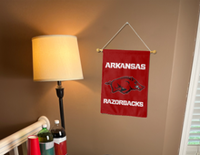 Load image into Gallery viewer, arkansas razorbacks garden flag hung inside a college dorm for dorm decor