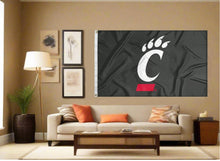 Load image into Gallery viewer, indoor display of black university of cincinnati flag for man cave decor